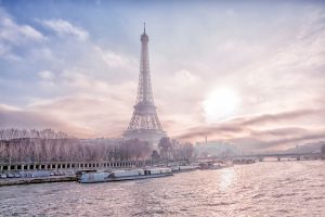 View of the Eiffel Tower, the main attraction of Paris from the View of the Eiffel Tower, the main attraction of Paris from the Seine River embankment on a winter frosty evening, France